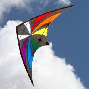 Colorful kite flying against a blue sky with white clouds