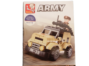 Toy army vehicle set on a wooden surface with packaging in the background