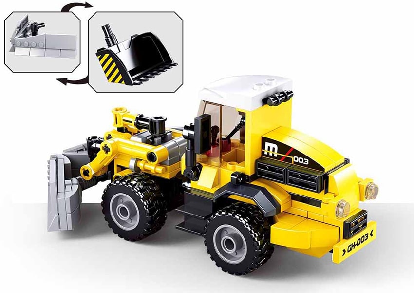 Toy bulldozer with movable parts on a white background