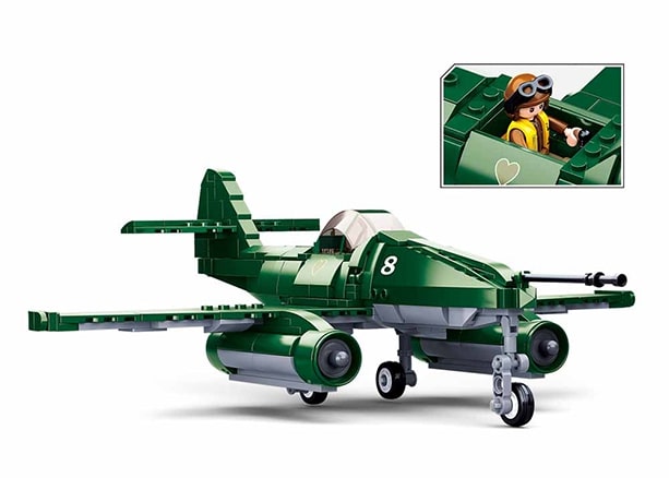 Toy airplane model with a small inset showing a person inside the cockpit.