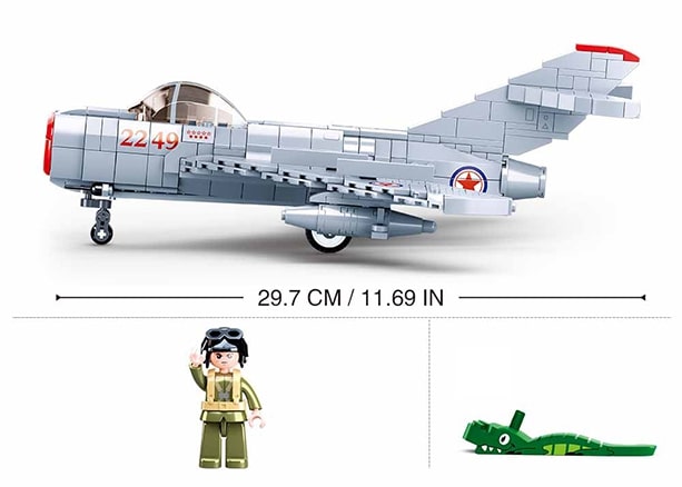 Toy airplane model with a figure and weapon, showing dimensions on a white background