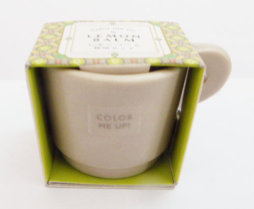 Beige mug with 'lemon balm Color Me Up' text in a patterned box on a white background