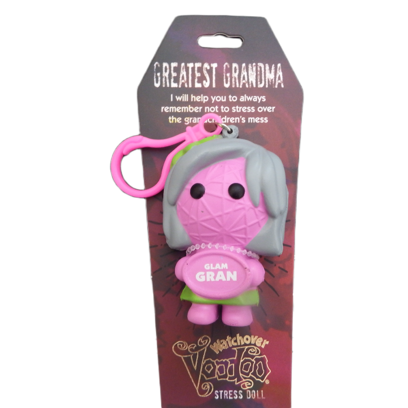 Stress doll with pink hair and green dress on a purple packaging background