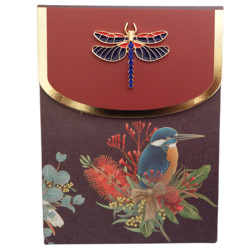 Bling Note Pad with a kingfisher design with Australian native flowers on purple background. A decorative dragon fly on closing flap with a red and gold border