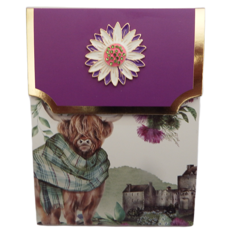 Card with a purple top featuring a floral design, a highland cow, and a scenic background.
