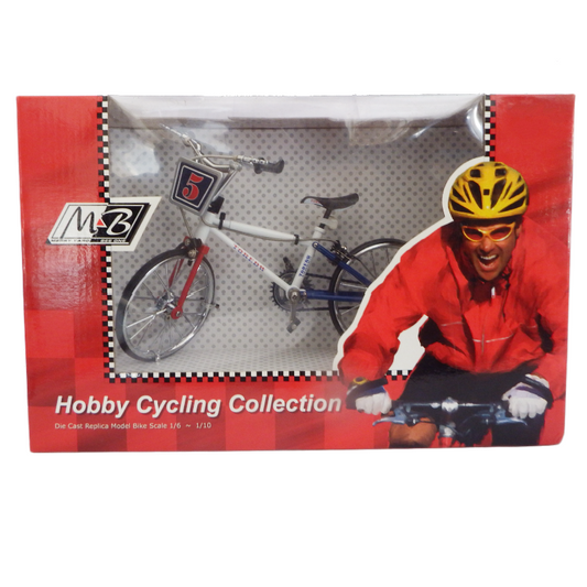 Model bicycle in packaging with cyclist illustration and M2B branding