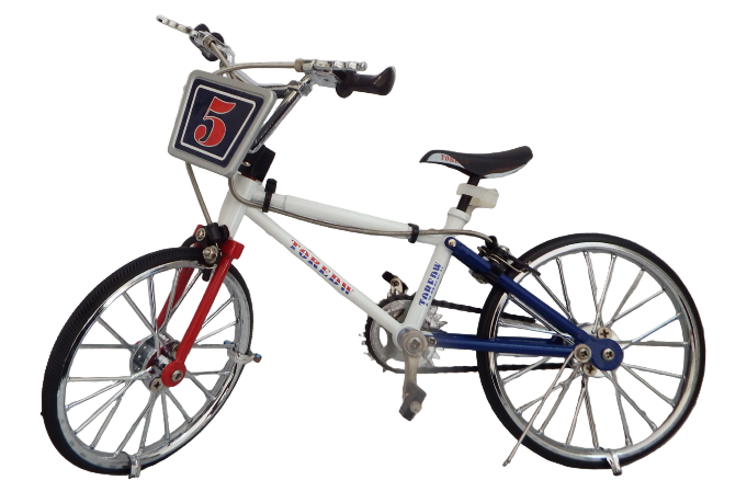 Model bicycle with red and blue accents on a textured surface