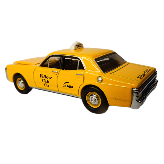 Model of a yellow taxi cab with 'Yellow Cab Co' branding on a white background
