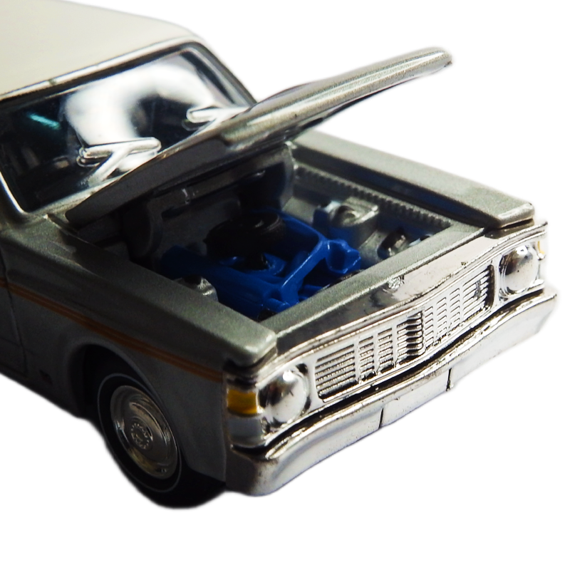 Model car with open hood showing blue engine on a white background