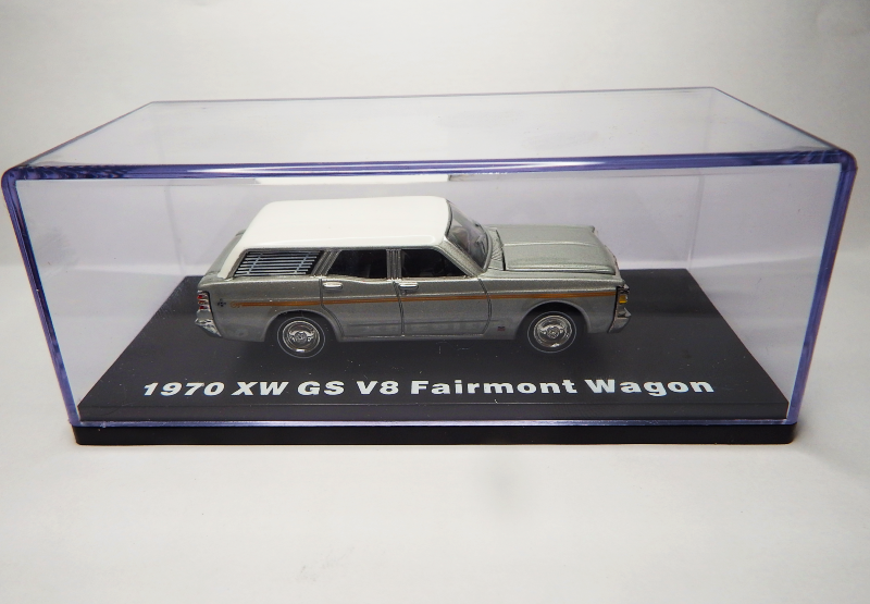 Model of a 1970 XW GS V8 Fairmont Wagon in a clear display case on a white background
