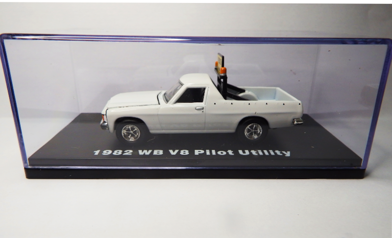 Model of a 1982 WB V8 Pilot Utility truck in a display case.