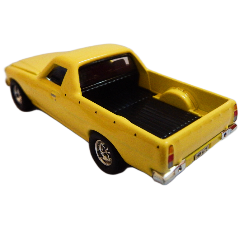 1:64 scale diecast Yellow model ute 1982 WB V8 on a white background