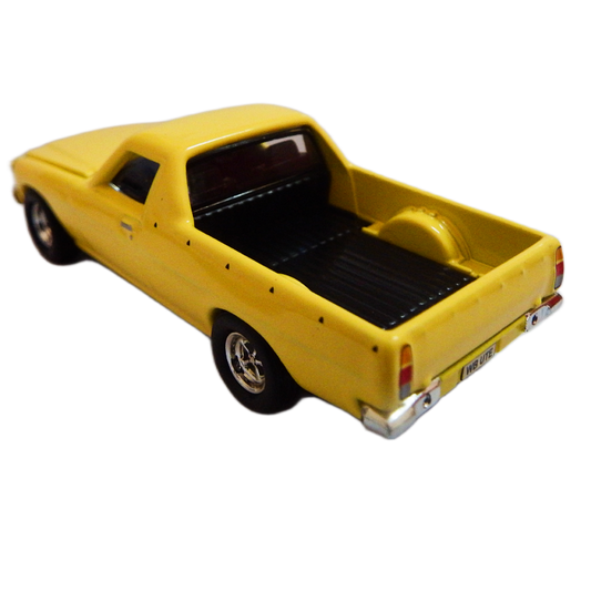 1:64 scale diecast Yellow model ute 1982 WB V8 on a white background