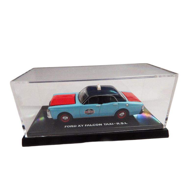Model taxi in a clear display case on a white background