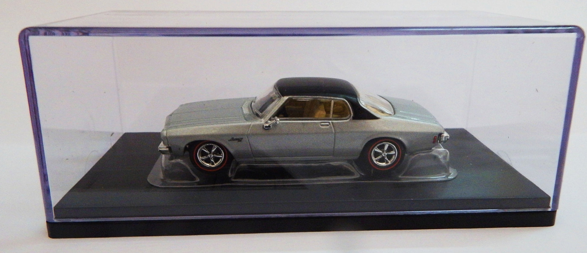 Cooee Classics Road Rager diecast model car 1:64 scale 1973 HQ Monaro LS 2 Door Silver with black roof Model in a clear display case on a white background