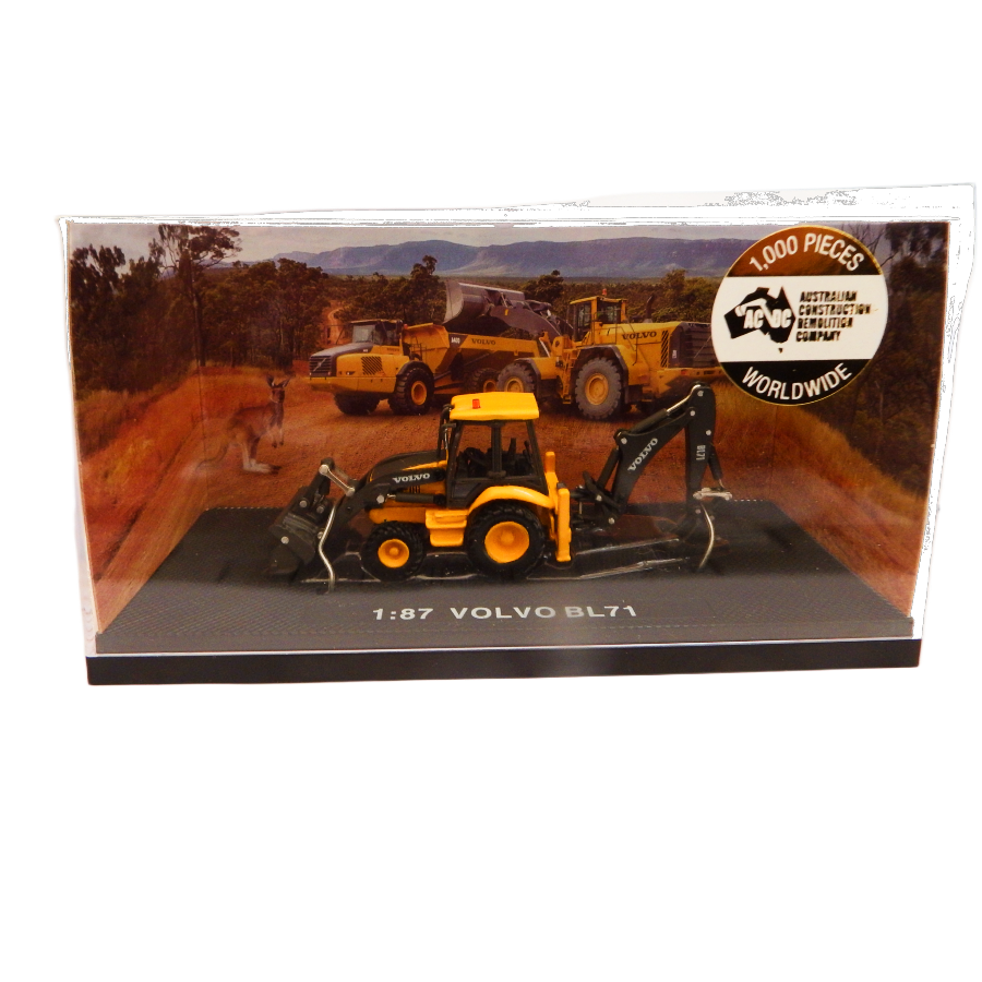 Model Volvo BL71 construction vehicle in packaging with scenic background
