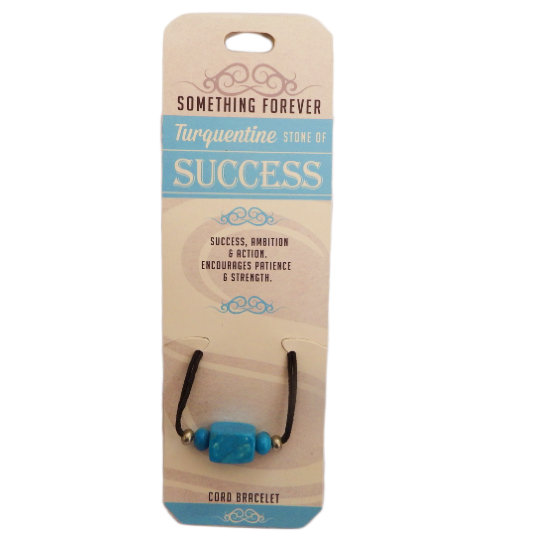 A turquoise beaded bracelet on an elastic band, packaged on a card text 'Turquoise', 'Success', 'Ambition', Encourages patience & strength.