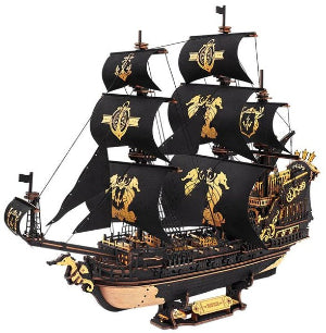 Model of a pirate ship with black sails and gold details on a white background