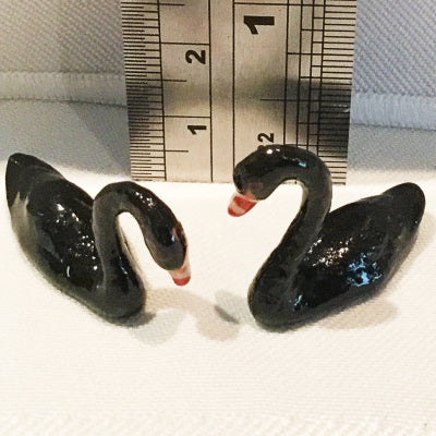 black swan porcelain figurines with ruler