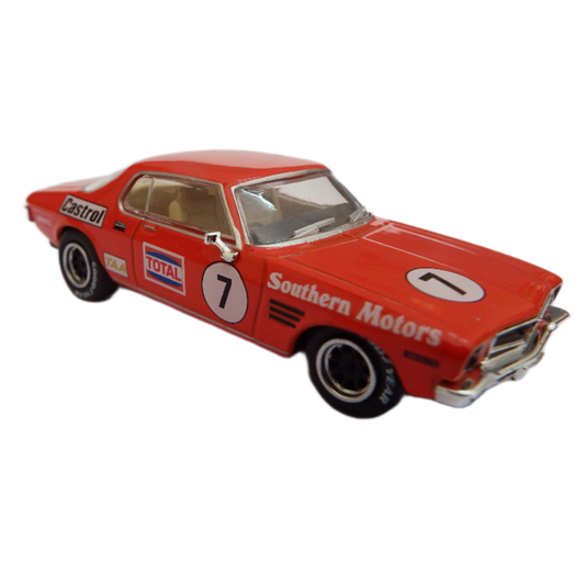 Red model car with racing decals on a white background