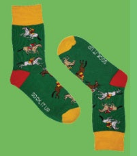 Green sock with horse and jockey design on a green background