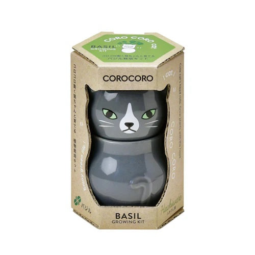 grey Cat-shaped container with green label in hexagonal cardboard packaging on a white background