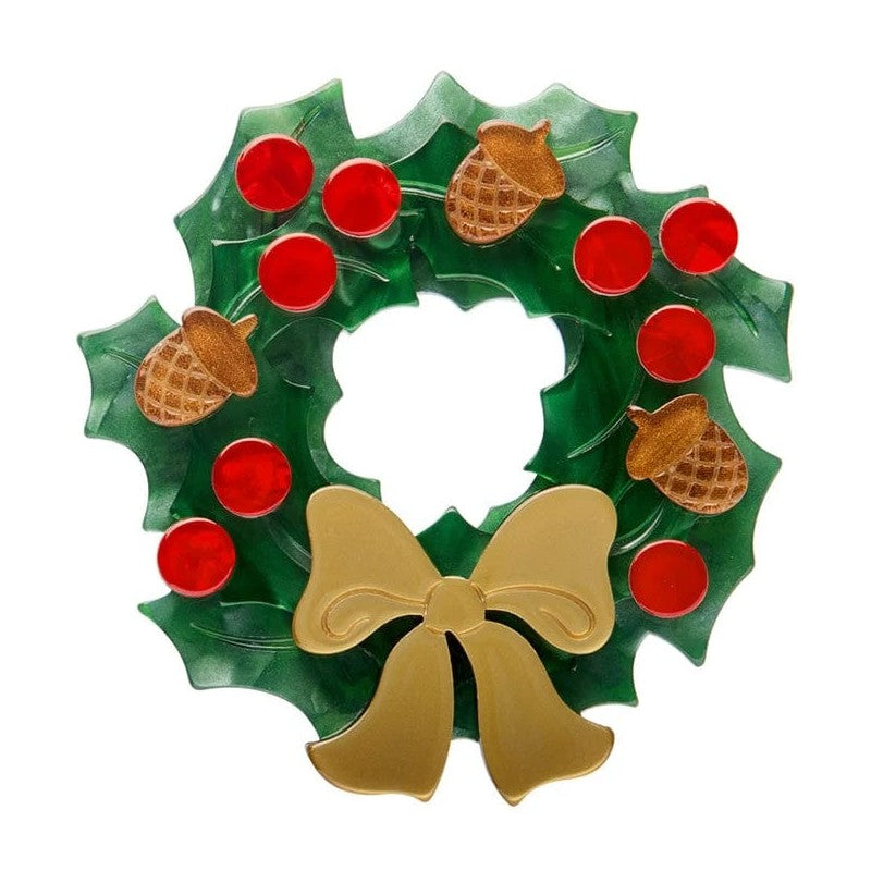 Erstwilder Christmas wreath Brooch with red berries, acorns, and a gold bow on a white background