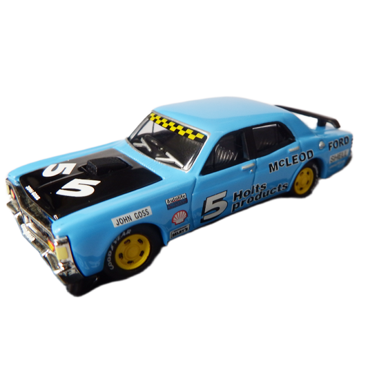 Model race car with various sponsor logos on a white background