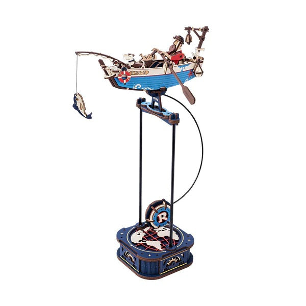 Rokr Gravity Swing Ocean Fisher Decorative model of a fishing boat on a stand with a white background