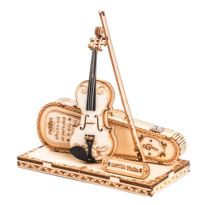 Gold violin model with bow on a white background