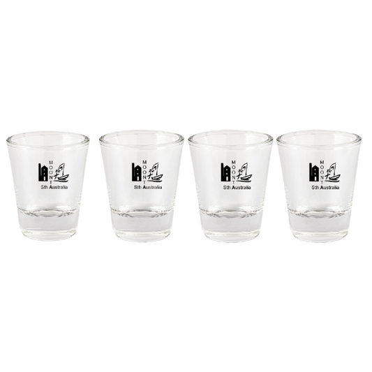 Four clear shot glasses with black text and symbols on a white background