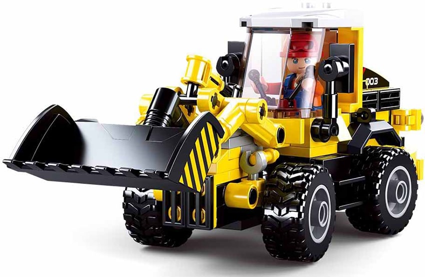 Toy bulldozer made of interlocking bricks on a white background