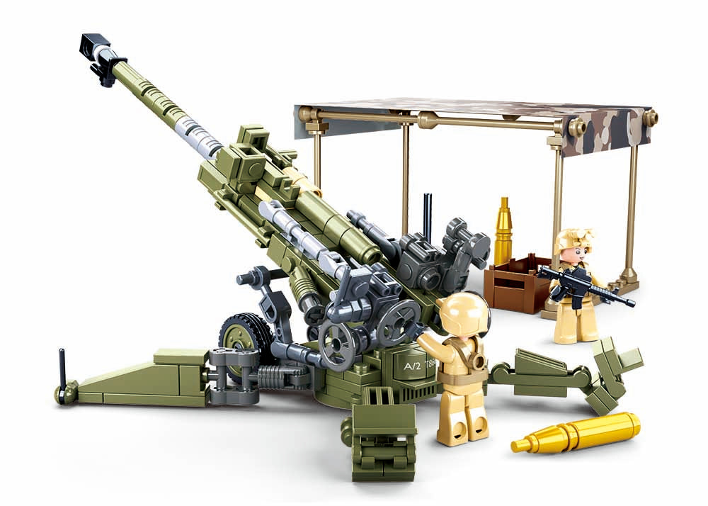 Toy model of a Howitzer Gun Emplacment with figures and equipment on a white background