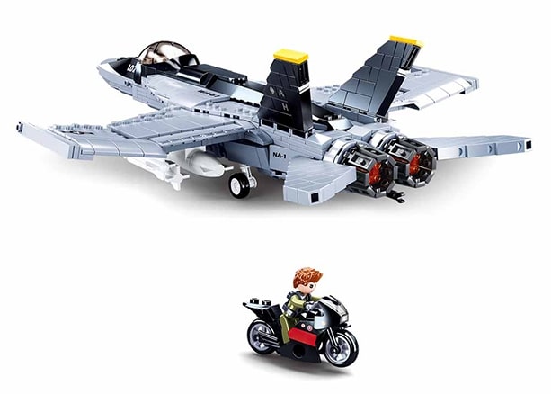 Toy model of a fighter jet and motorcycle on a white background