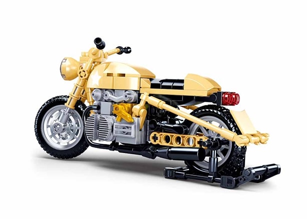 Toy motorcycle made of interlocking bricks on a white background