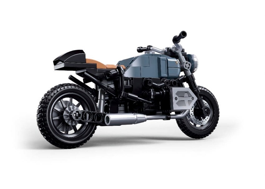 Model motorcycle made of interlocking bricks on a white background