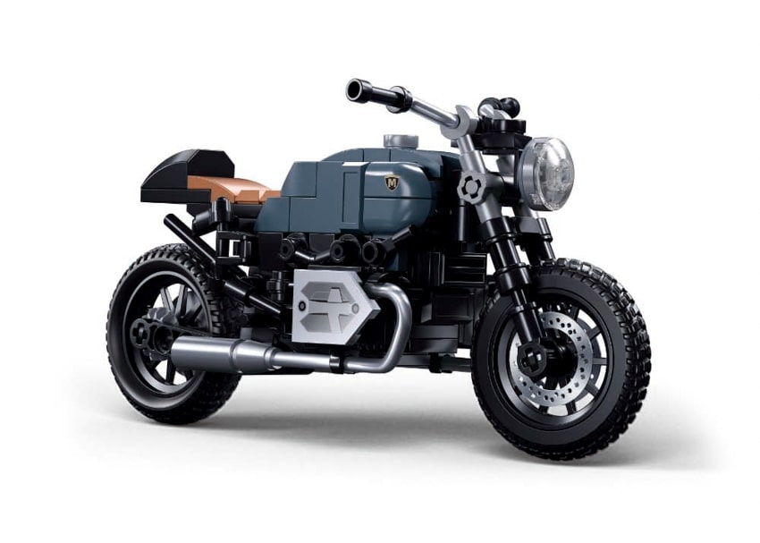 Model motorcycle made of interlocking bricks on a white background