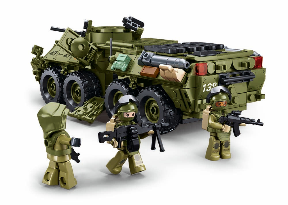 Toy military vehicle with figures on a white background