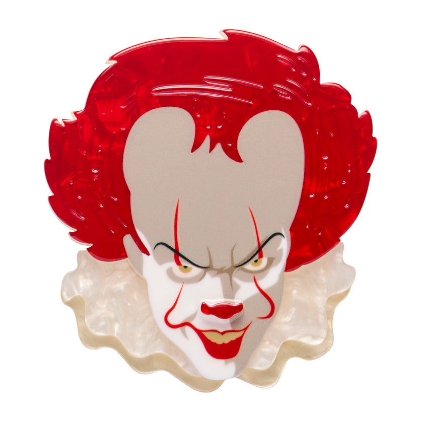Erstwilder Jewellery Brooch  character Pennywise  From the Movie IT with a design of a clown's face on a white background