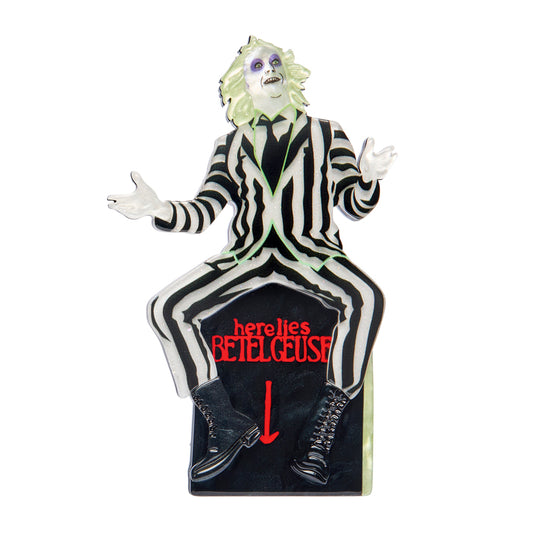 Erstwilder brooch figure of a character from 'Beetlejuice' with a black and white striped suit on a white background.