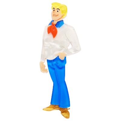 Fred Jones Erstwilder brooch  character with a white shirt, blue pants, and red scarf on a white background