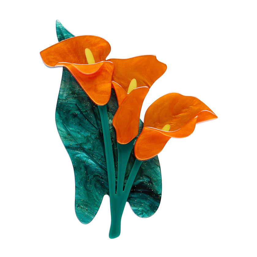 Ersatwilder Brooch with orange flowers and green leaves on a white background