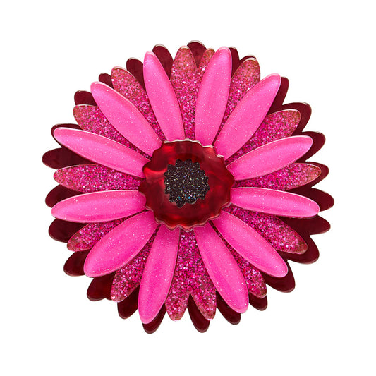 Pink and red glittery flower-shaped n Erstwilder Brooch on a white background