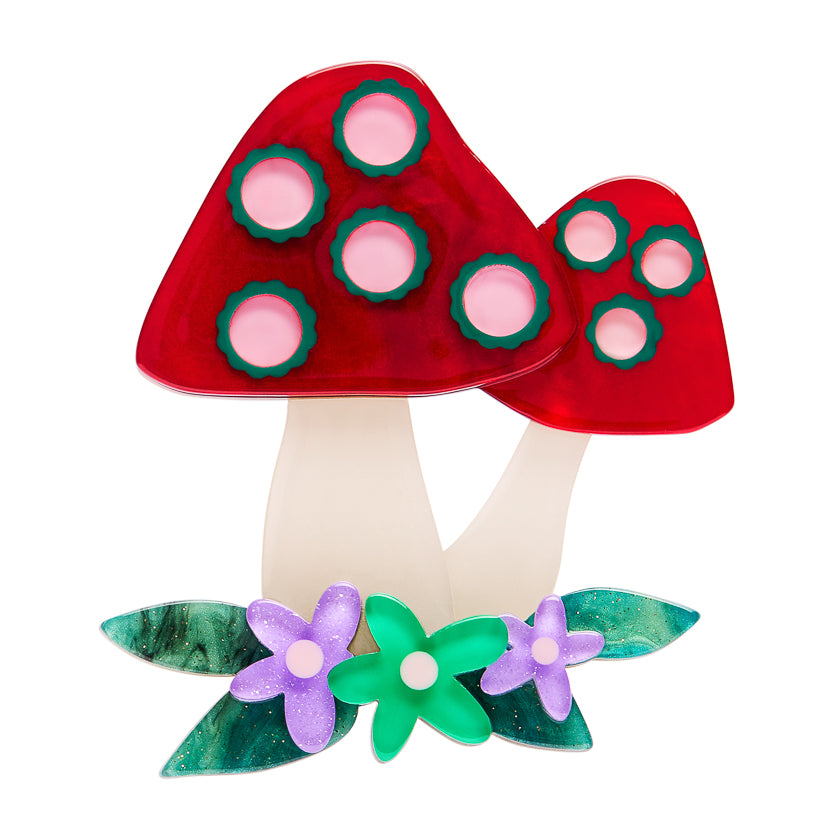 erstwilder Brooches depicting red mushroom tops and floral base on a white background