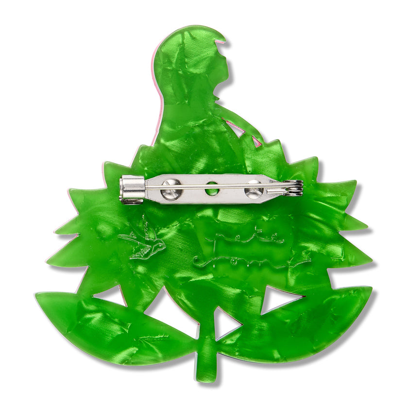 Green  back of pocket princess erstwilder brooch  with  erstwilder logo and pete cromer signature embeded into back  with stainless steel clip  and brooch  pin on a white background