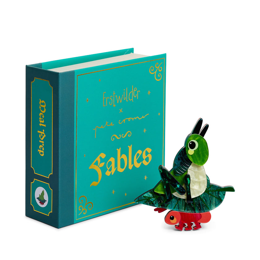 Teal book titled 'Fables' with a green grasshopper and red  red ant illustration   on a white background