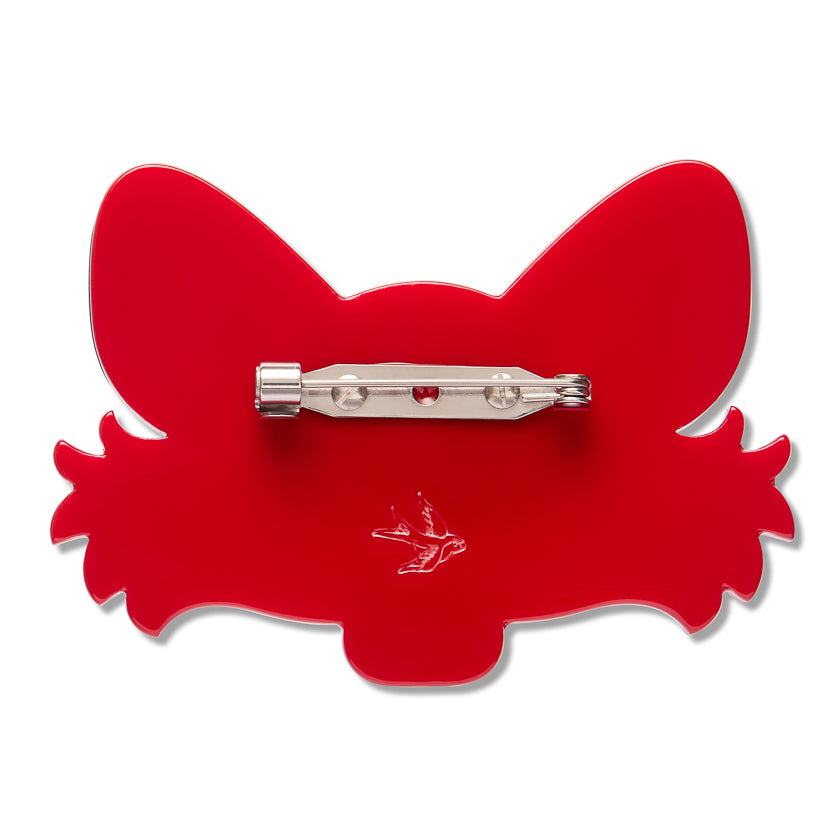 A bright red acrylic pinback brooch shaped like a stylized fox head, shown from the back with a silver-tone metal pin clasp across the center.