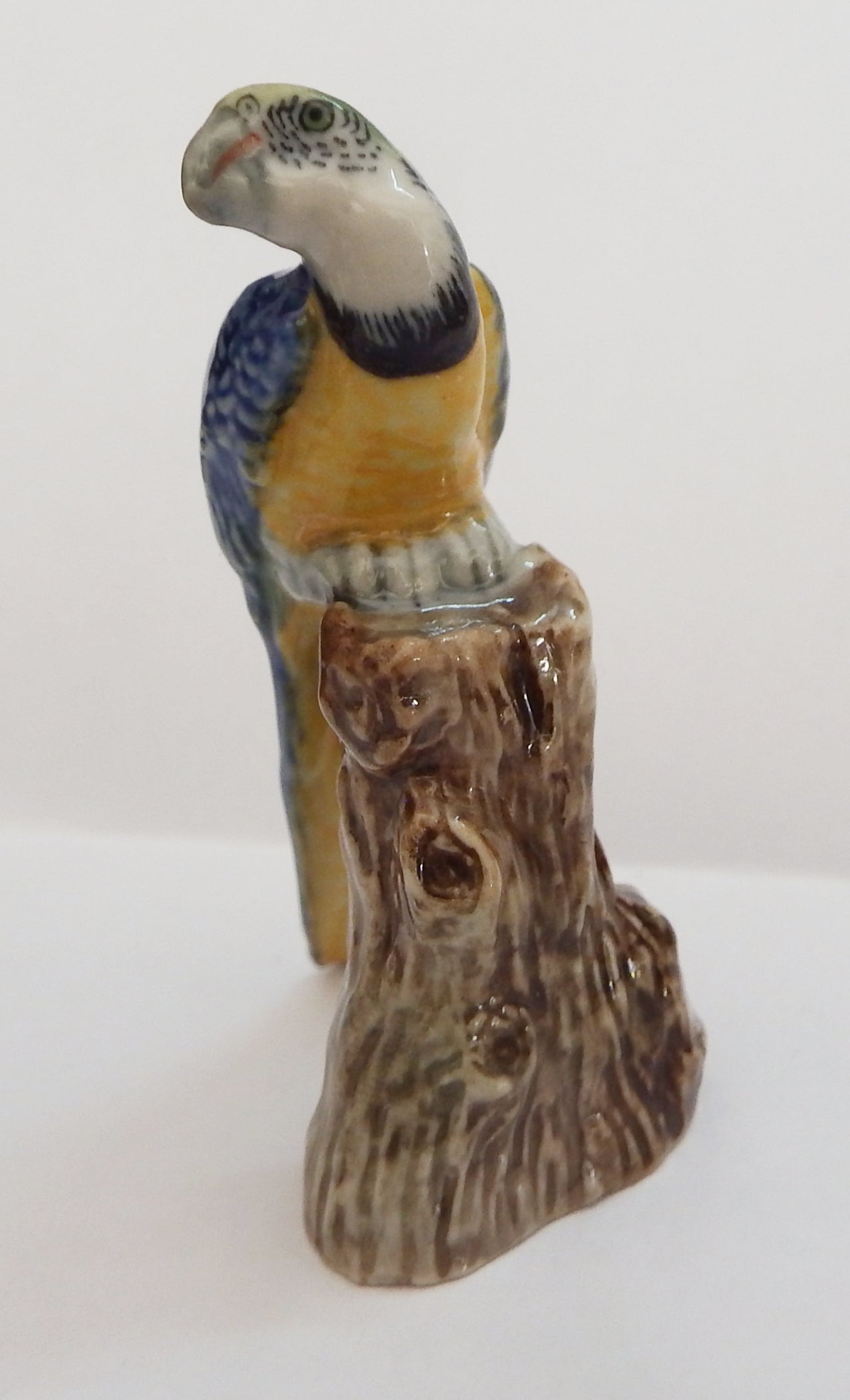 Blue Macaw head turned Porcelain miniature figurine