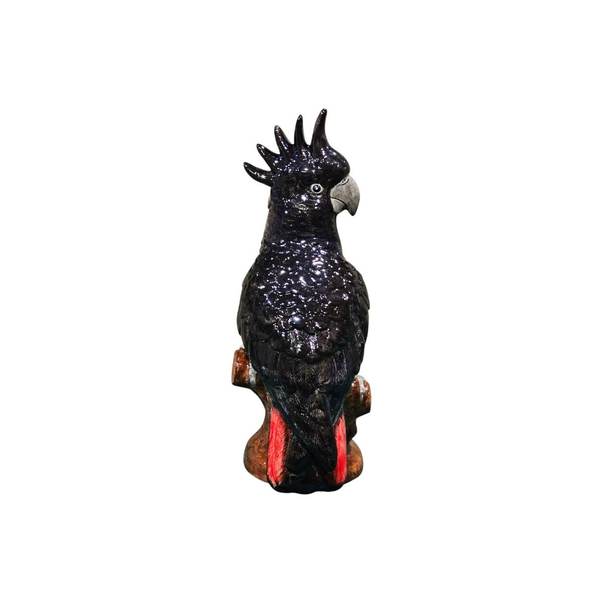 Black cockatoo figurine on a white background