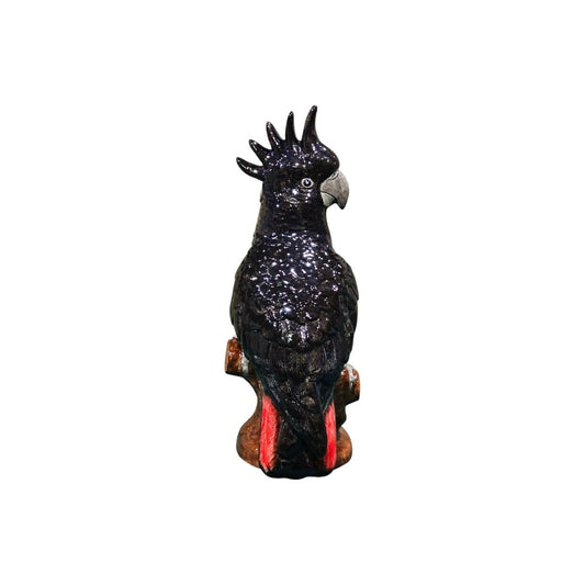 Black cockatoo figurine on a white background